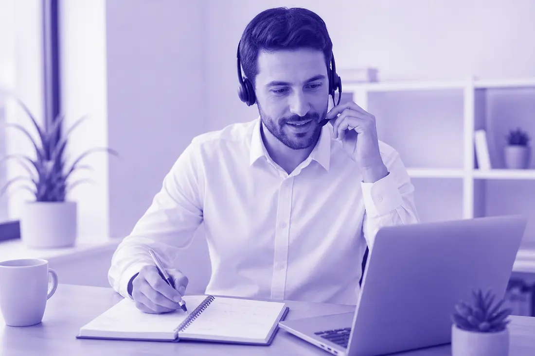 A Roimatics team member taking consultation bookings at a desk