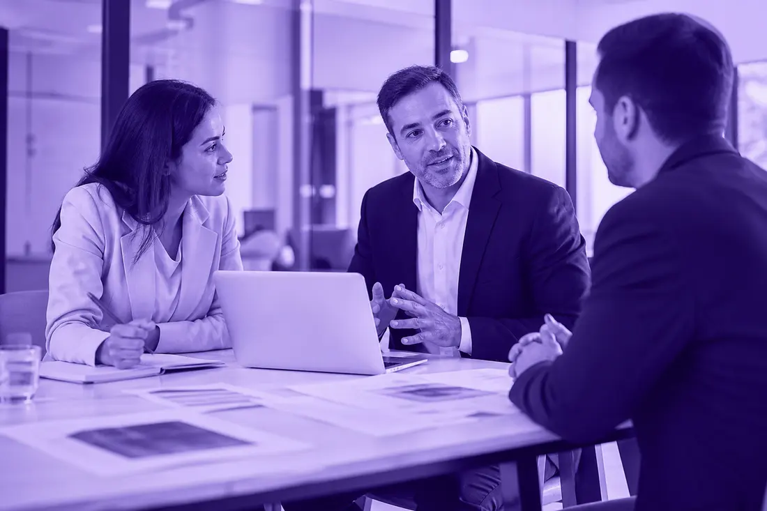 Two Roimatics consultants in a meeting with a client